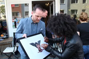 Onita Boone examining details

(Photo by Natascha Klein)